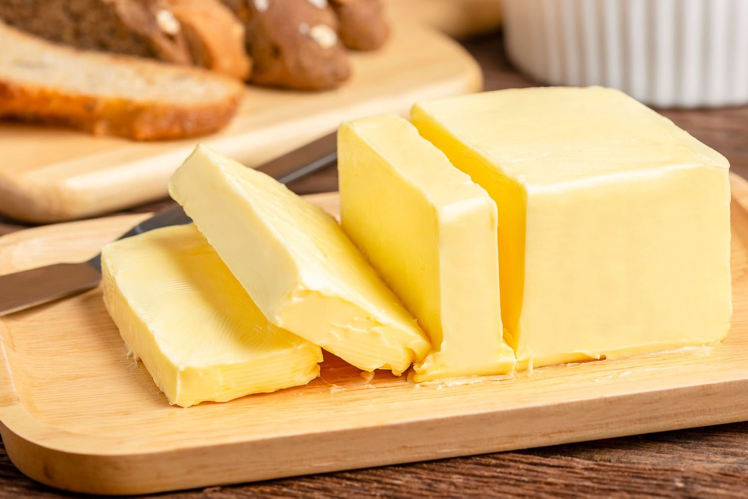 Buffalo butter is a rich, creamy dairy product made from the cream of buffalo milk, which has a higher fat content than cow's milk. It is typically white or off-white, has a delicate aroma, and a slightly different flavor profile compared to cow butter, often described as having a richer taste and a slightly sour or almond aftertaste. It can be used for cooking, making ghee, or enjoyed fresh on bread.